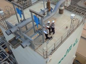 Air Products technicians standing on top of air separation unit