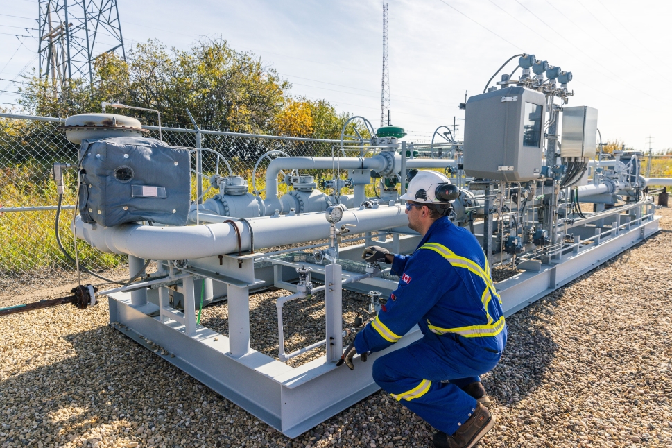 Air Products technician inspecting pipeline at Edmonton hydrogen plant in Alberta, Canada