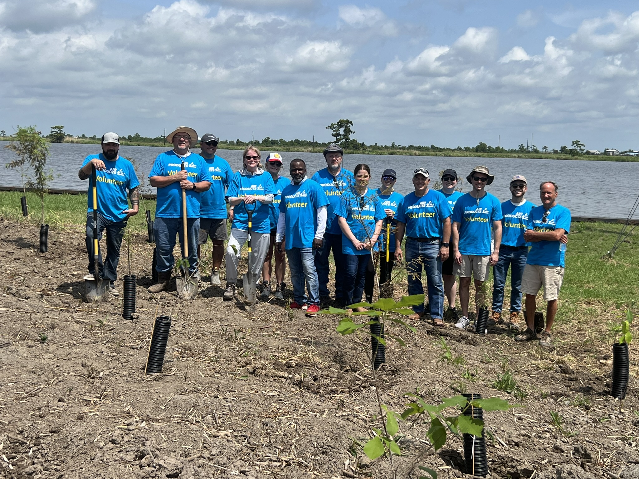 Air Products employees planting cypress trees at the Turtle Cove Research Center on Lake Maurepas in Louisiana